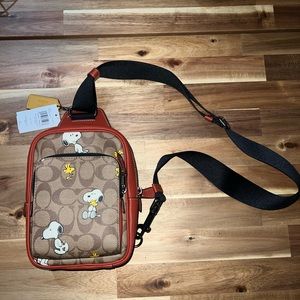 COACH X PEANUTS TRACK PACK 14 IN SIGNATURE CANVAS WITH SNOOPY WOODSTOCK PRINT